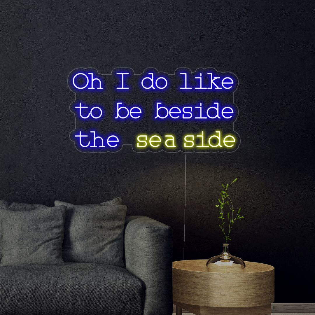 "Oh I do like to be beside the seaside" Insegna al neon