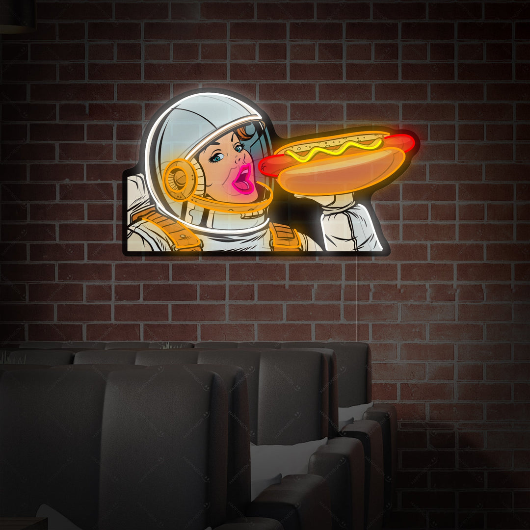 "Donna astronauta che mangia hot dog" Insegna al neon