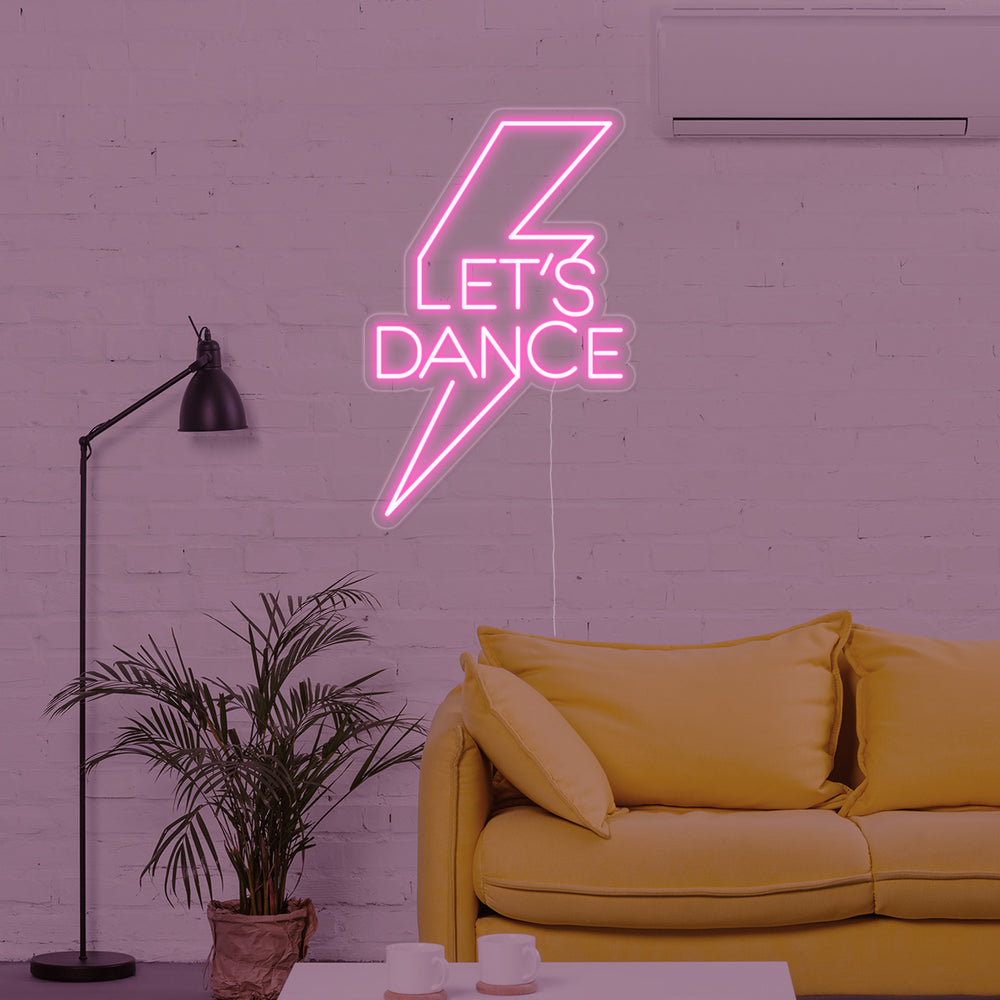 Insegna al neon LED rosa con scritta “Let’s Dance” e fulmine.